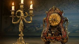Lumiere (candlestick holder with lit candles) and Cogsworth (clock)