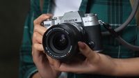 Fujifilm X-T50 being held in a photographer's hands