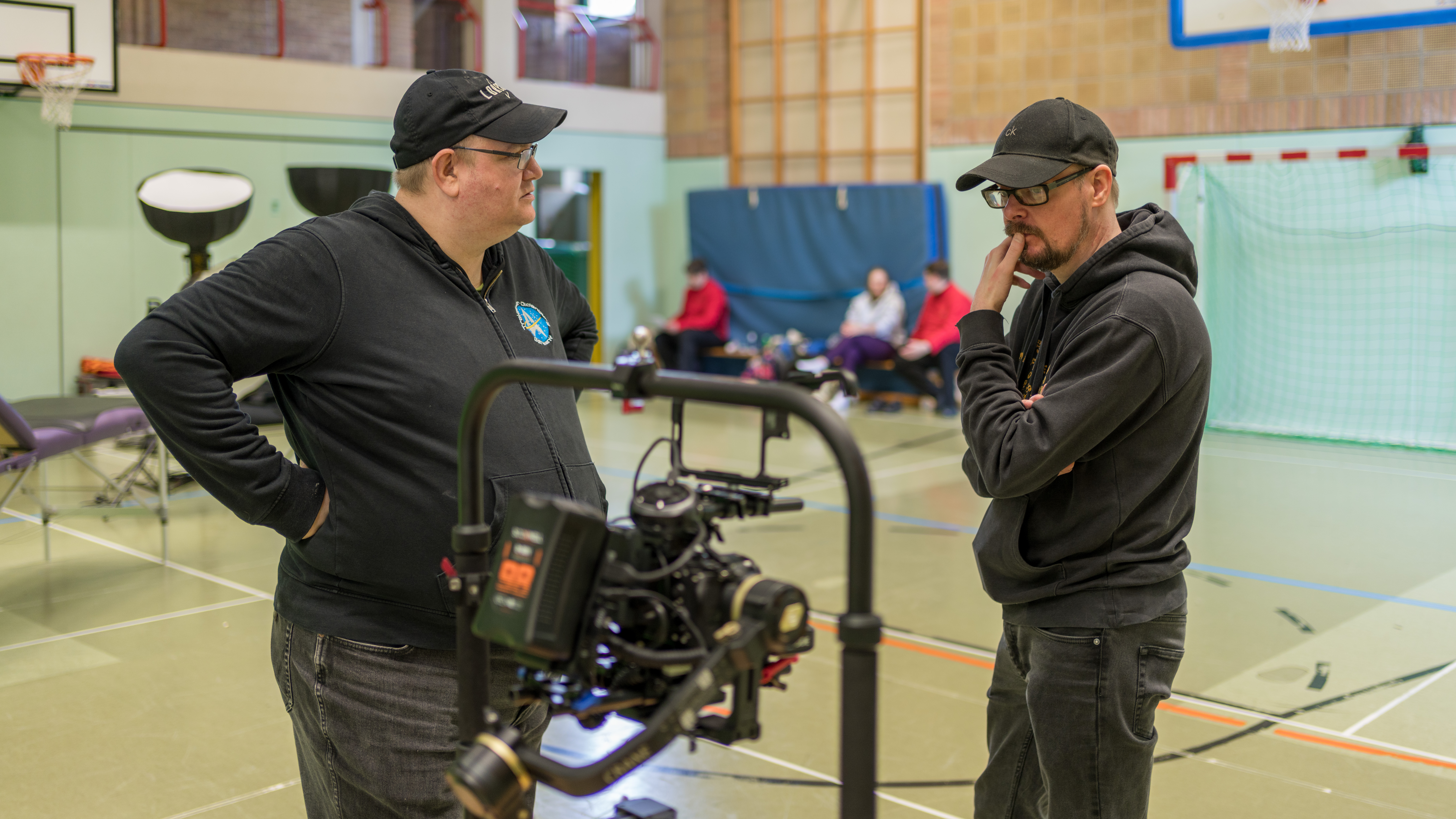 A man looks at a camera