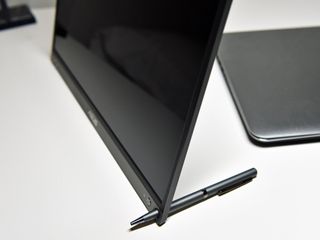 The ZenScreen has a small hole to literally jam a pen into to it for a makeshift stand. Clever, but weird.
