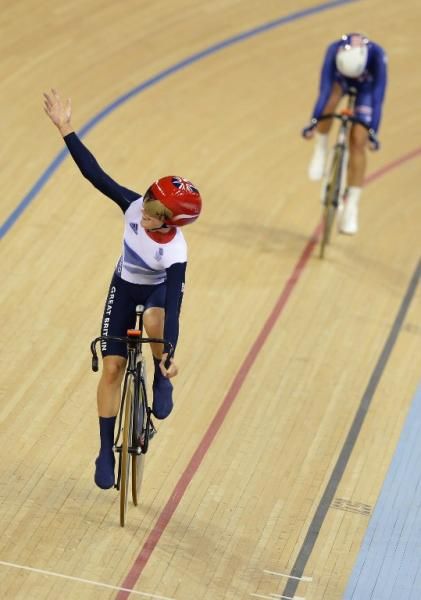 Britain's Laura Trott celebrates after winning the London 2012 Olympic Games women's omnium elimination race