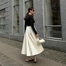 @annabelrosendahl wearing slingback kitten heels with skirt and top