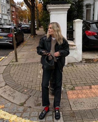 London based influencer Lucy Williams in black jeans, leather jacket and loafers