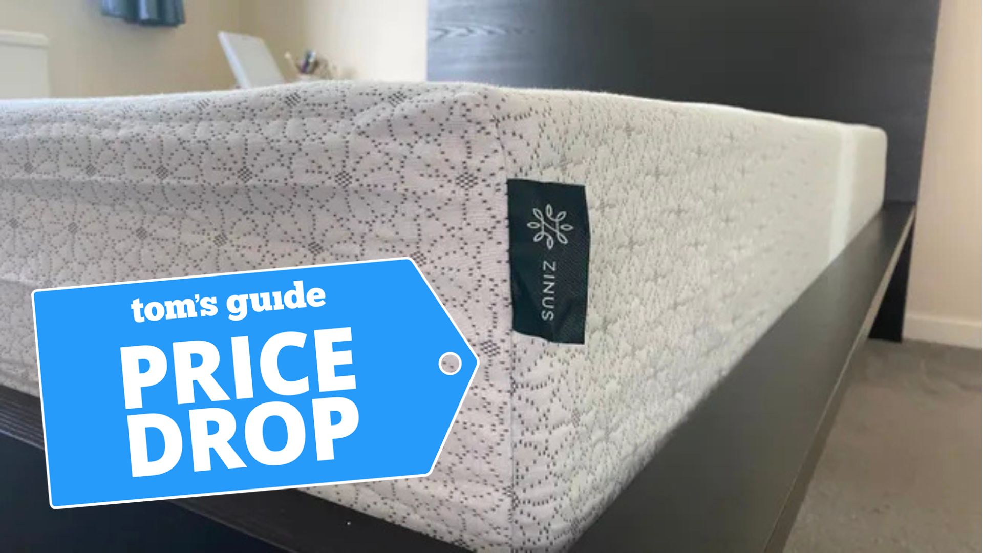 A close-up shot of the corner of the Zinus Green Team Memory Foam Mattress with a deals badge in the bottom left-hand corner.