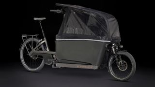 Trek Fetch plus two cargo bike in black with optional rain fly cover