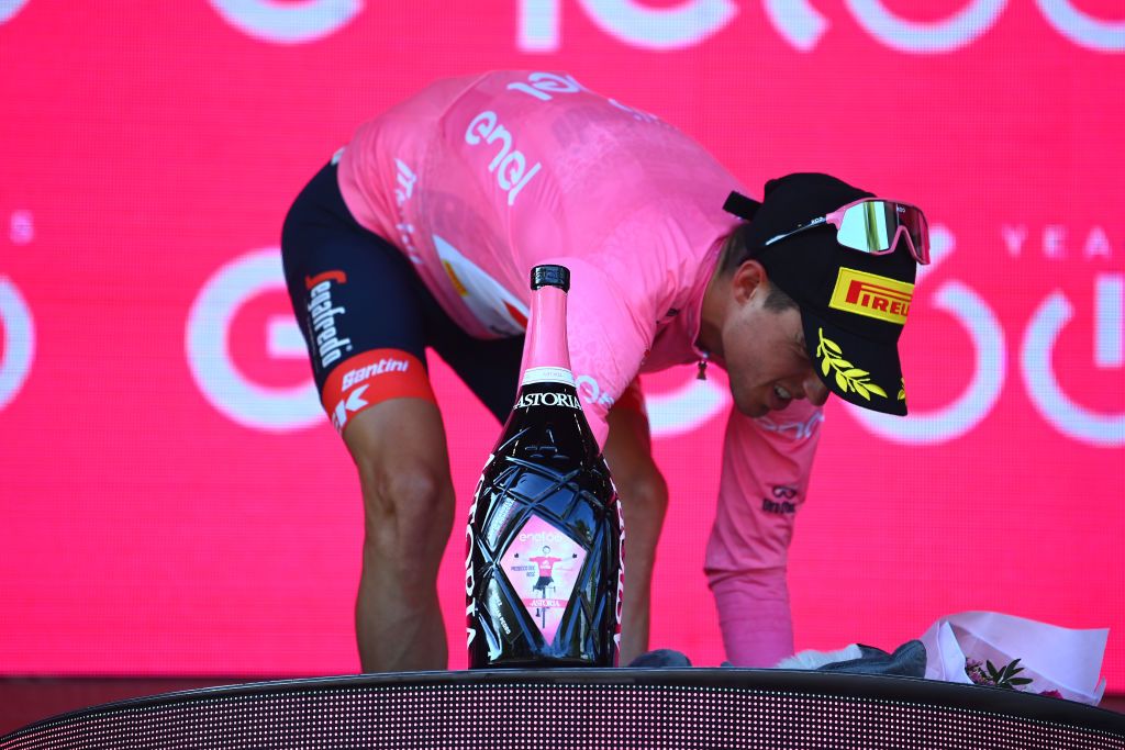 REGGIO EMILIA ITALY MAY 18 Juan Pedro Lpez of Spain and Team Trek Segafredo Pink Leader Jersey celebrates at podium with Astoria Champagne during the 105th Giro dItalia 2022 Stage 11 a 203km stage from Santarcangelo di Romagna to Reggio Emilia Giro WorldTour on May 18 2022 in Reggio Emilia Italy Photo by Tim de WaeleGetty Images