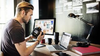 A man takes an online camera course