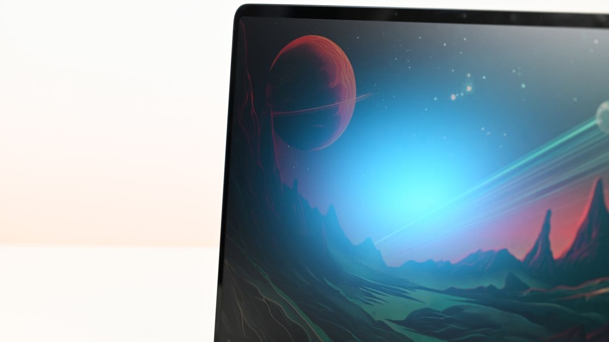 Surface Laptop for Business 8th Edition screen displays a vibrant space scene with a red planet and distant stars. The landscape is illuminated by a blue glow, creating a serene atmosphere.