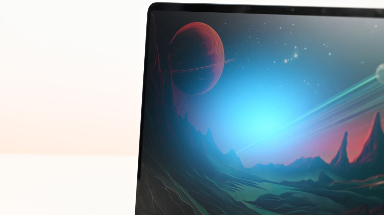 Surface Laptop for Business 8th Edition screen displays a vibrant space scene with a red planet and distant stars. The landscape is illuminated by a blue glow, creating a serene atmosphere.