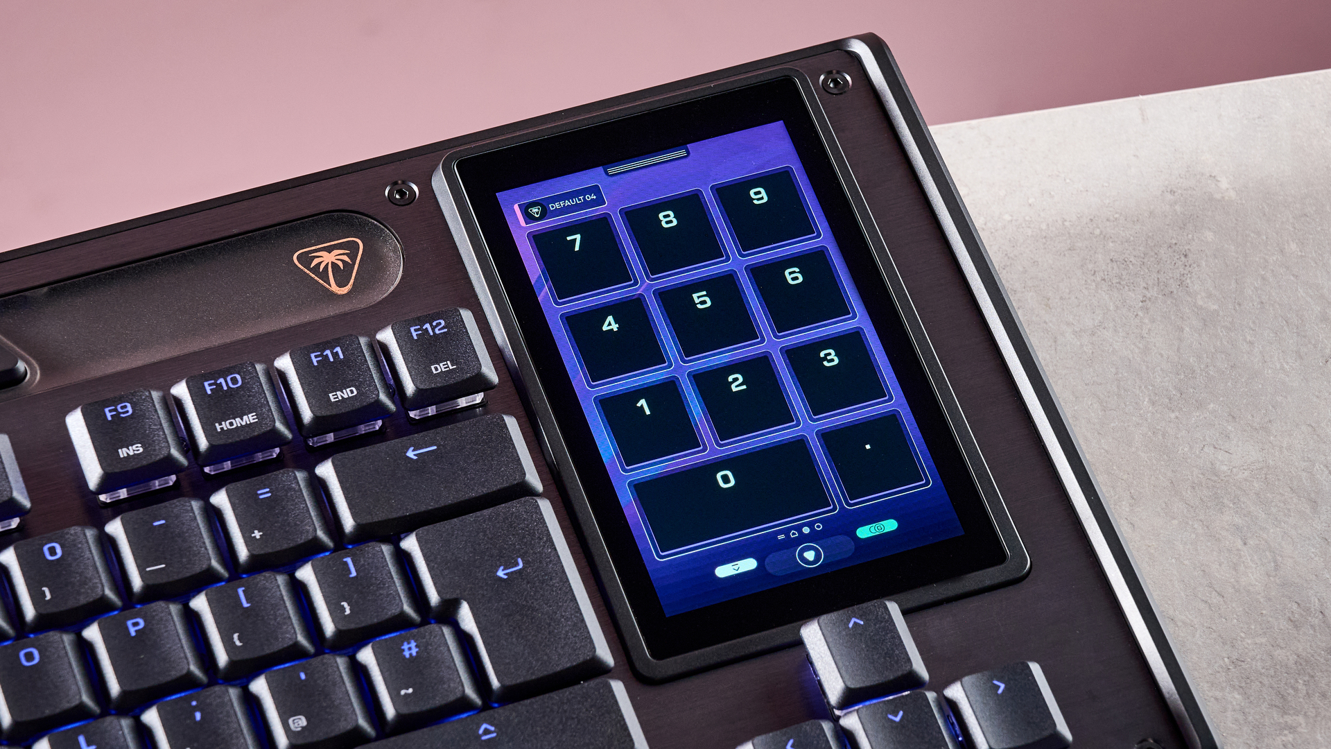 A closeup of the Turtle Beach Command Series KB7's built-in touchscreen featuring numbers on the screen.