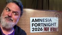 Tim Schafer side-eyeing an Amnesia Fortnight 2026 Indie Reboot sign, as he does