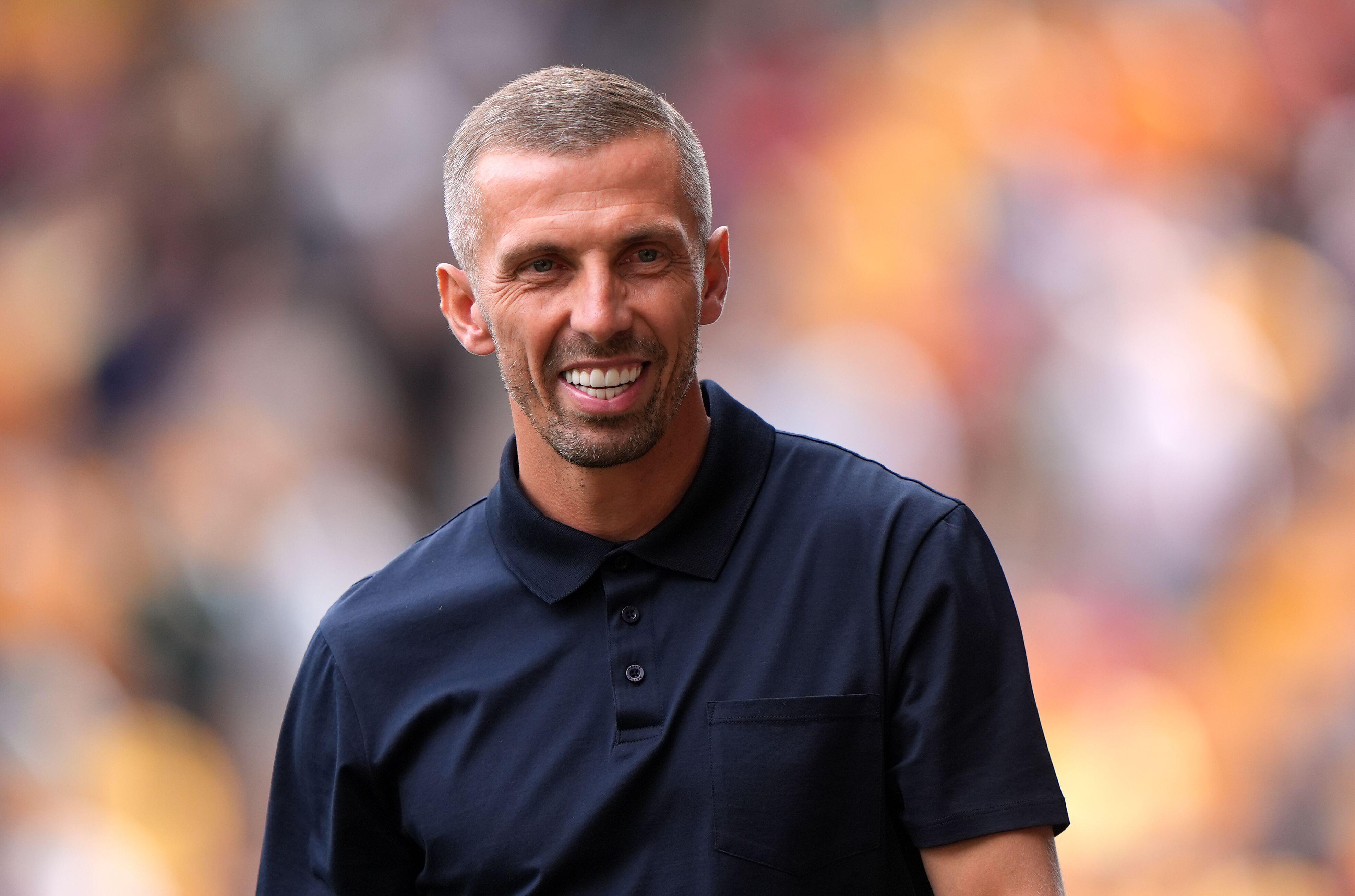 Gary O'Neil, smiling, walking.