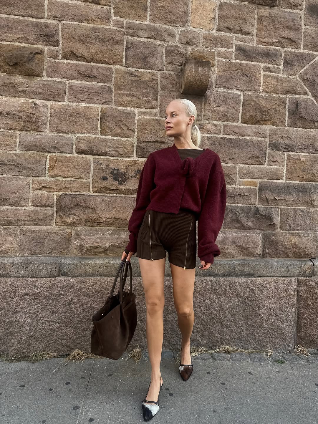 woman wearing brown maroon color trend fall 2025