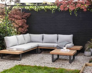 black wall with garden furniture set