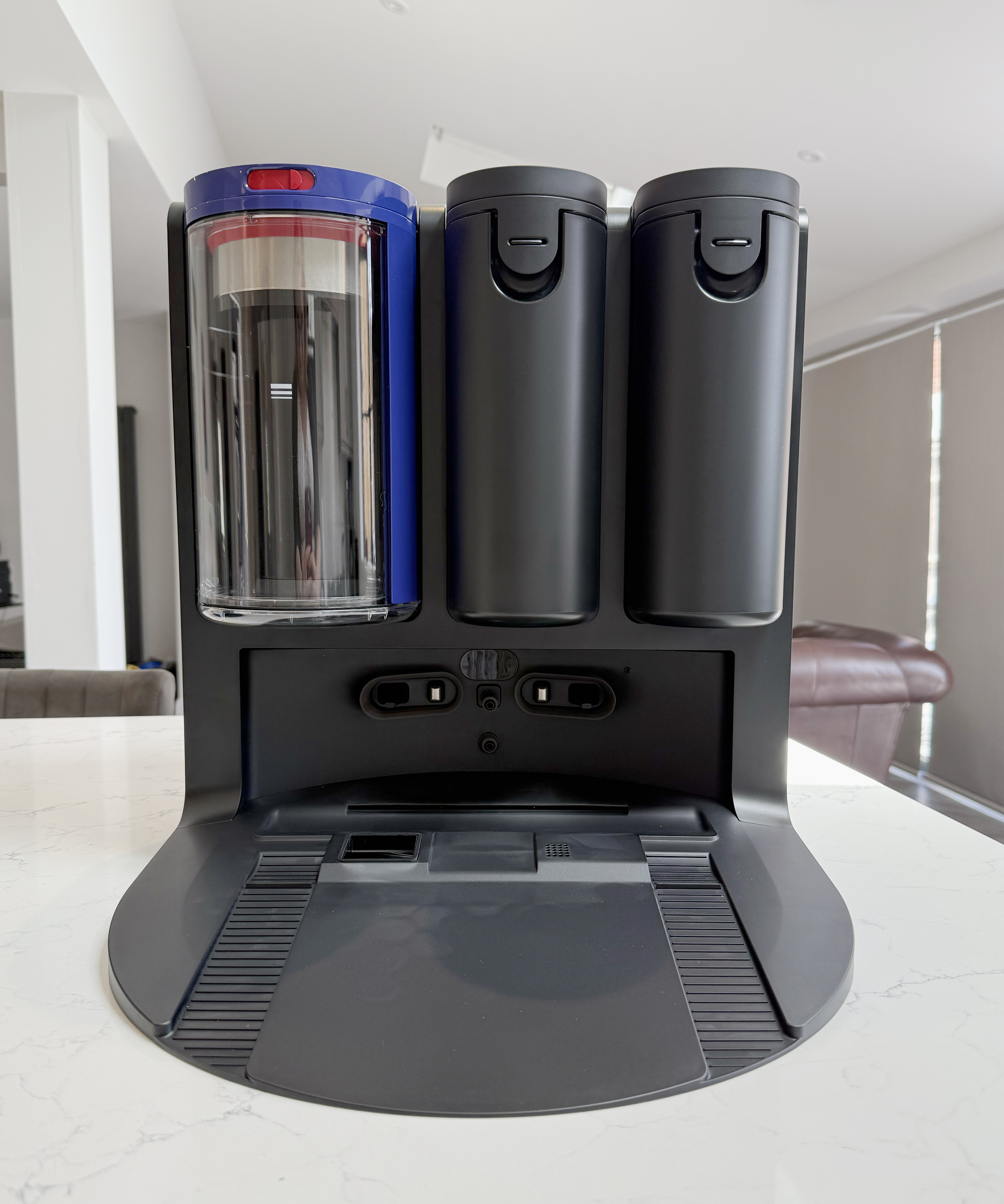 Dyson Spot+Scrub Ai dock shown from the front on a kitchen countertop