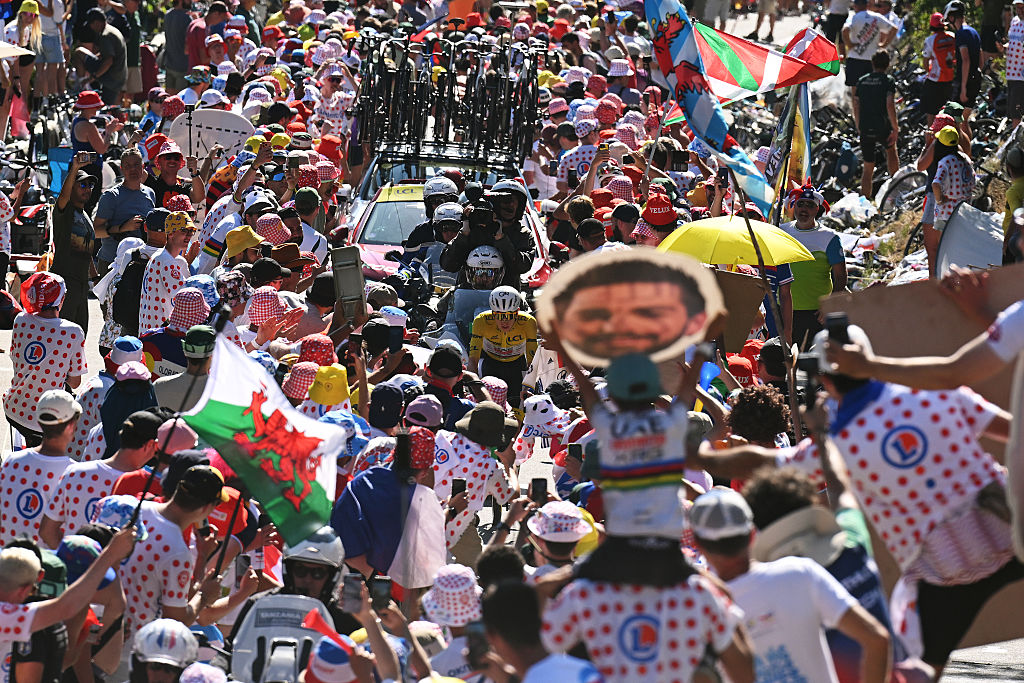 ALPE D&amp;amp;apos;HUEZ, FRANCE - JULY 24: Tadej Pogacar of Slovenia and UAE Team Emirates - XRG - Yellow Leader Jersey competes climbing to the Alpe d&amp;amp;apos;Huez (1835m) while fans cheers during the 113th Tour de France 2026, Stage 19 a 127.9km stage from Gap to Alpe d&amp;amp;apos;Huez 1835m / #UCIWT / on July 24, 2026 in Alpe d&amp;amp;apos;Huez, France. (Photo by Dario Belingheri/Getty Images)