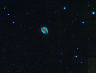 Helix Nebula and Asteroid Tracks
