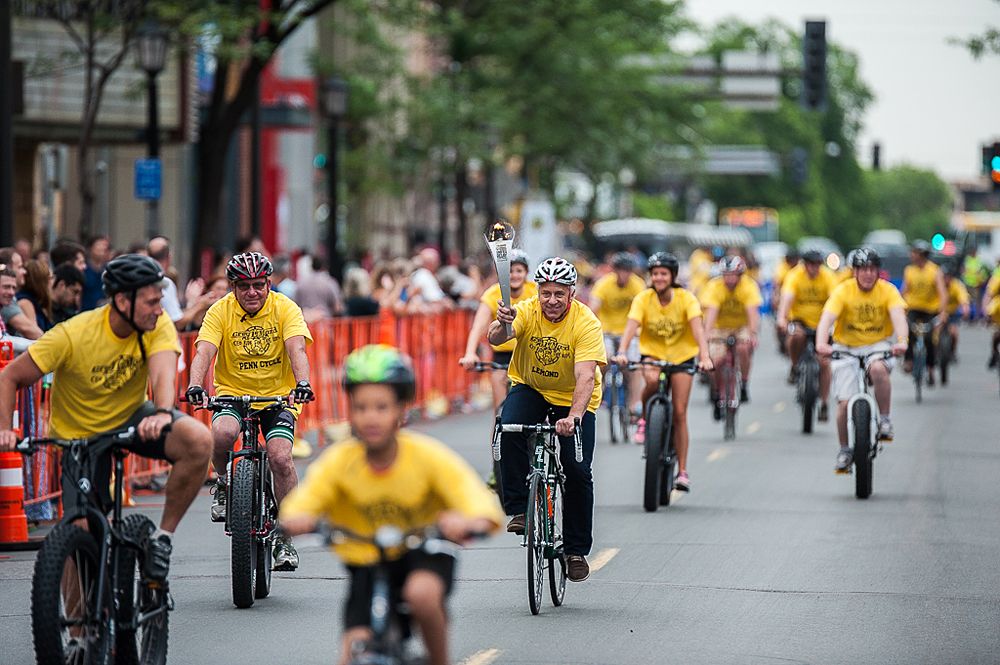 reg Lemond rides with CEO's and Special Olypmic athletes while caring the Special Olympic torch as it passes through Minnesota