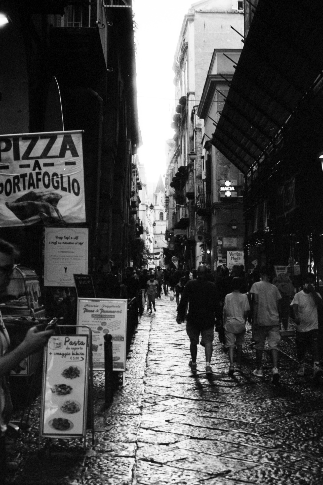 Street in Naples with pizza sign