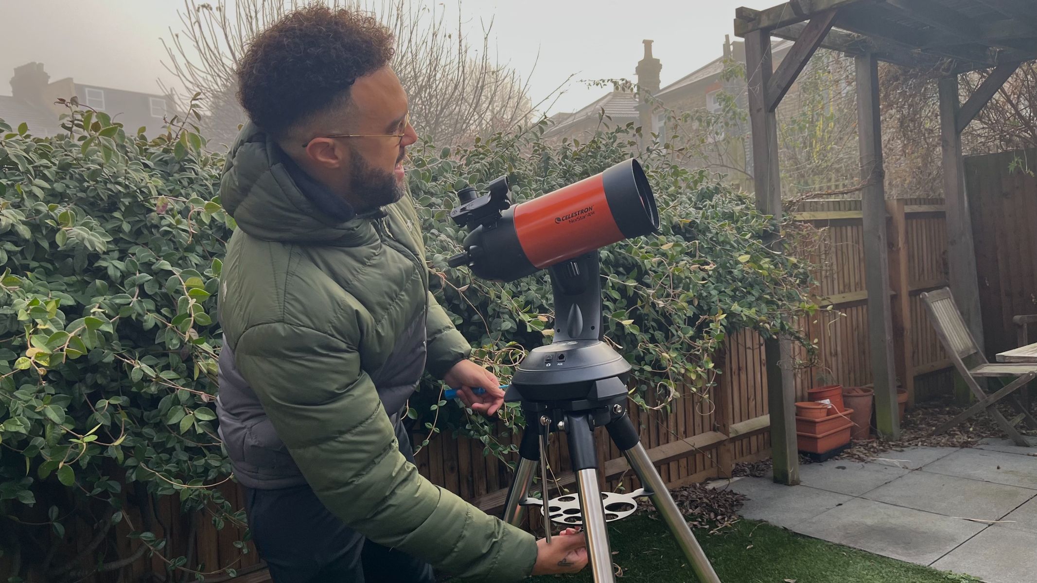 Author operating the telescope in the back yard