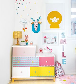 white nursery with painted chest of drawers