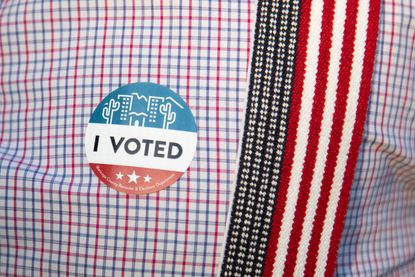 An "I Voted" sticker on an Arizona voter.