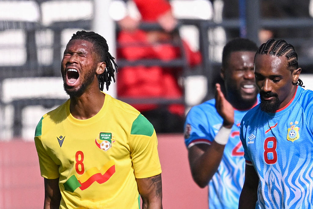 Benin's midfielder #08 Imourane Hassane (L) and Democratic Republic Of Congo's midfielder #08 Samuel Moutoussamy react during the Africa Cup of Nations (CAN) Group D football match between Democratic Republic of Congo and Benin at Al Medina Stadium in Rabat on December 23, 2025. (Photo by SEBASTIEN BOZON / AFP)