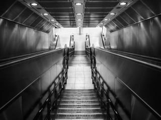 Mono image of an underground staircase taken on the OM System OM-3 with the OM System M.Zuiko 17mm f/1.8 II