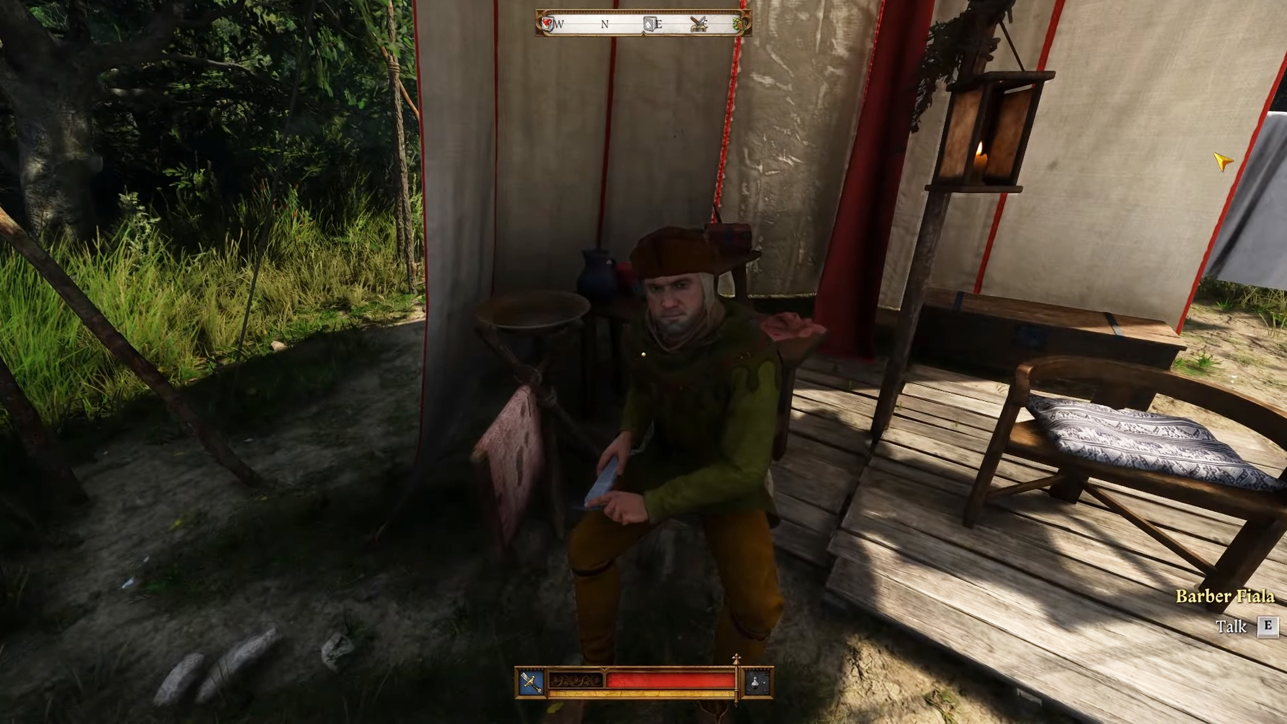 Kingdom Come Deliverance 2 barber change hairstyle - Barber Fiala sitting in his tent sharpening his blade.