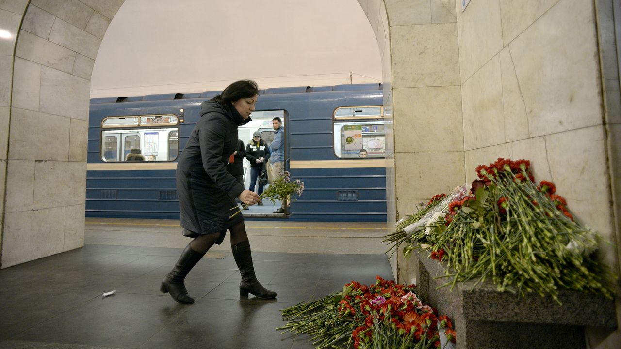Mourner leaves flowers after Russia terror attack