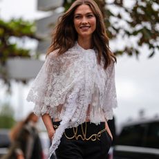 Woman in lace top and black pants