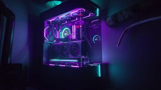 A gaming PC lit up with neon-style lighting and using an RX 9070 XT graphics card.