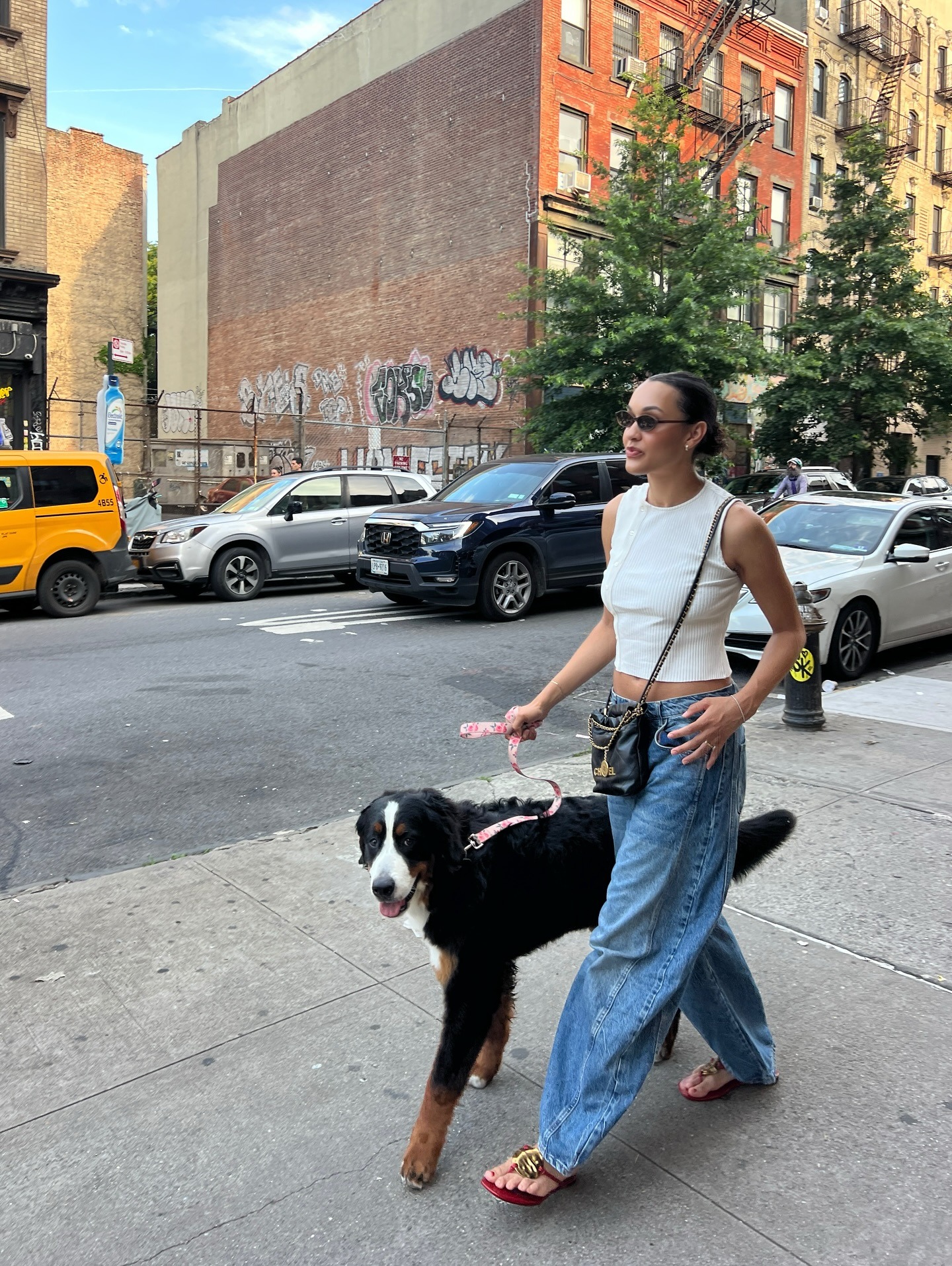 Woman wearing barrel leg jeans.
