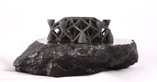 Another look at the geometric object 3D-printed by asteroid-mining company Planetary Resources and its partner 3D Systems using powdered asteroid metal.