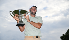 Scottie Scheffler holds the FedEx Cup trophy