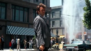 Clint Eastwood stands in a city block in Dirty Harry