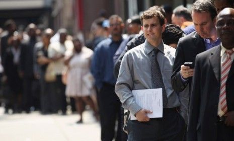 Applicants wait to enter a June job fair in New York City: The U.S. economy added just 80,000 jobs in June, falling short of six-figure expectations.