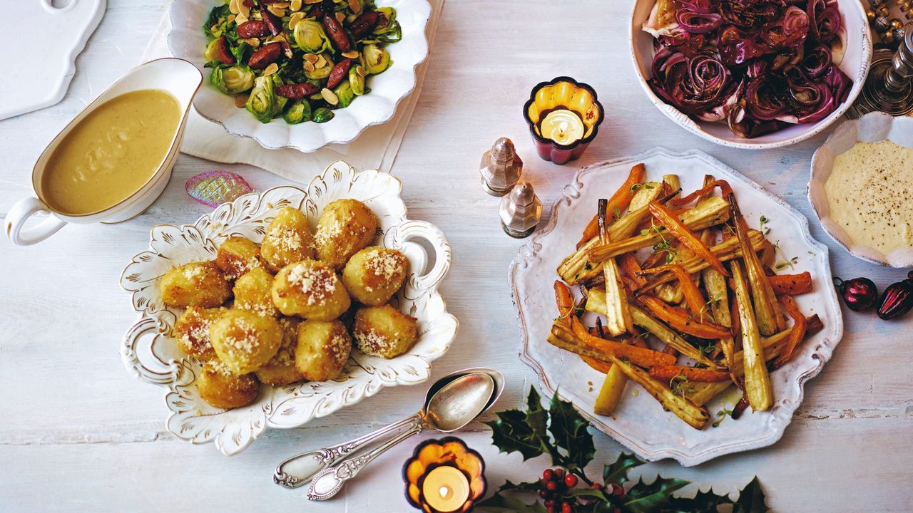 Roast potatoes and vegetables served on serving dishes