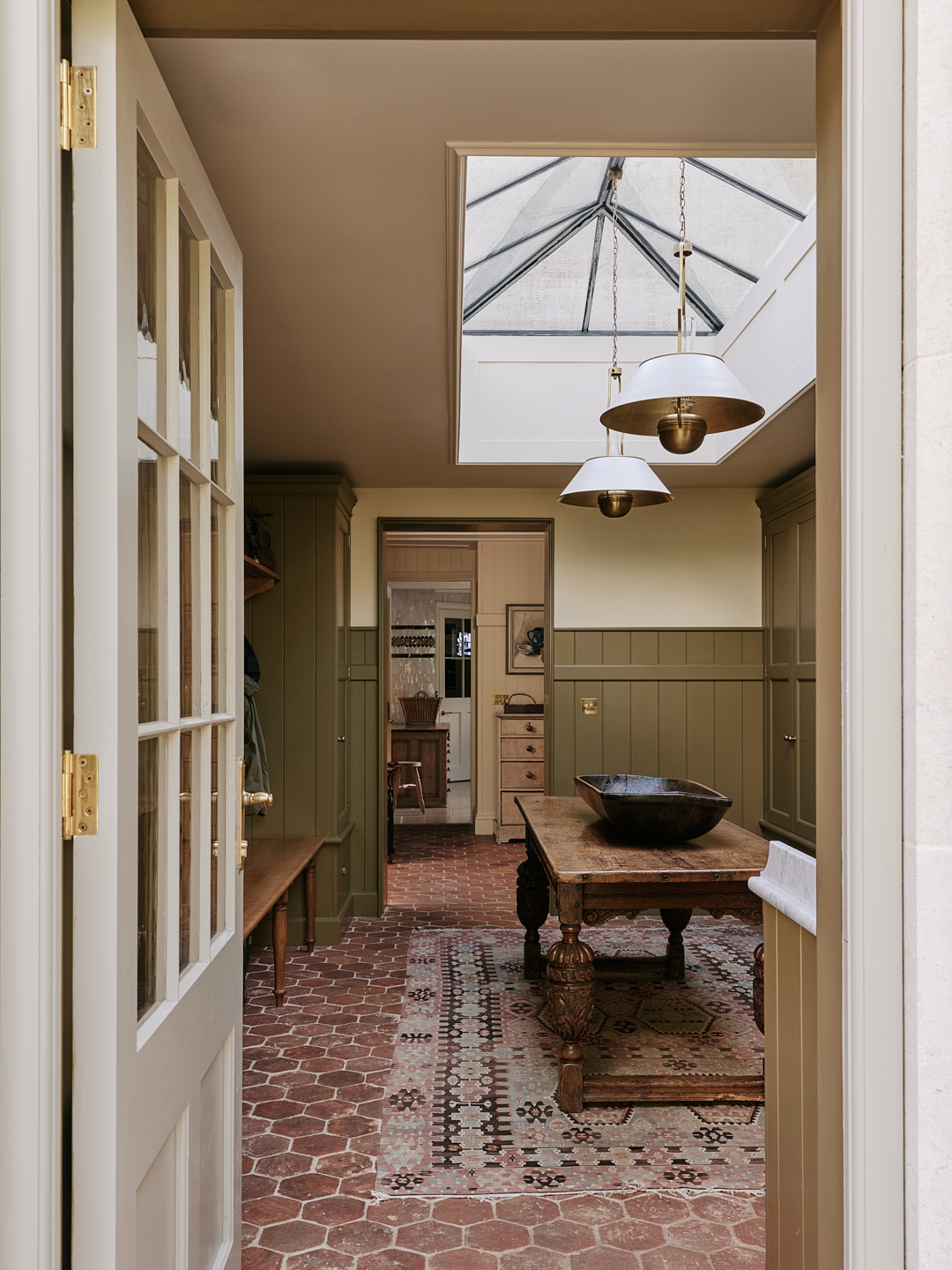 The traditional english country house interiors designed by Salvesen Graham. Lots of soft hues, rugs, and an eclectic style
