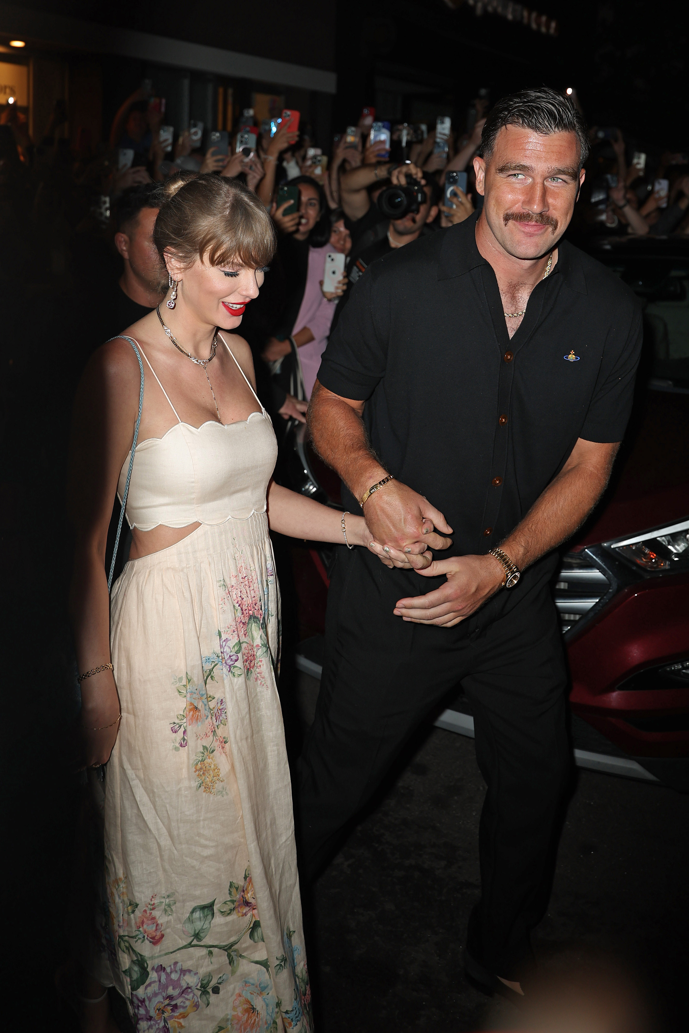 Maren Morris shares a souvenir from Taylor Swift and Travis Kelce's wedding, which is a white embroidered doily napkin featuring lyrics from Blank Space