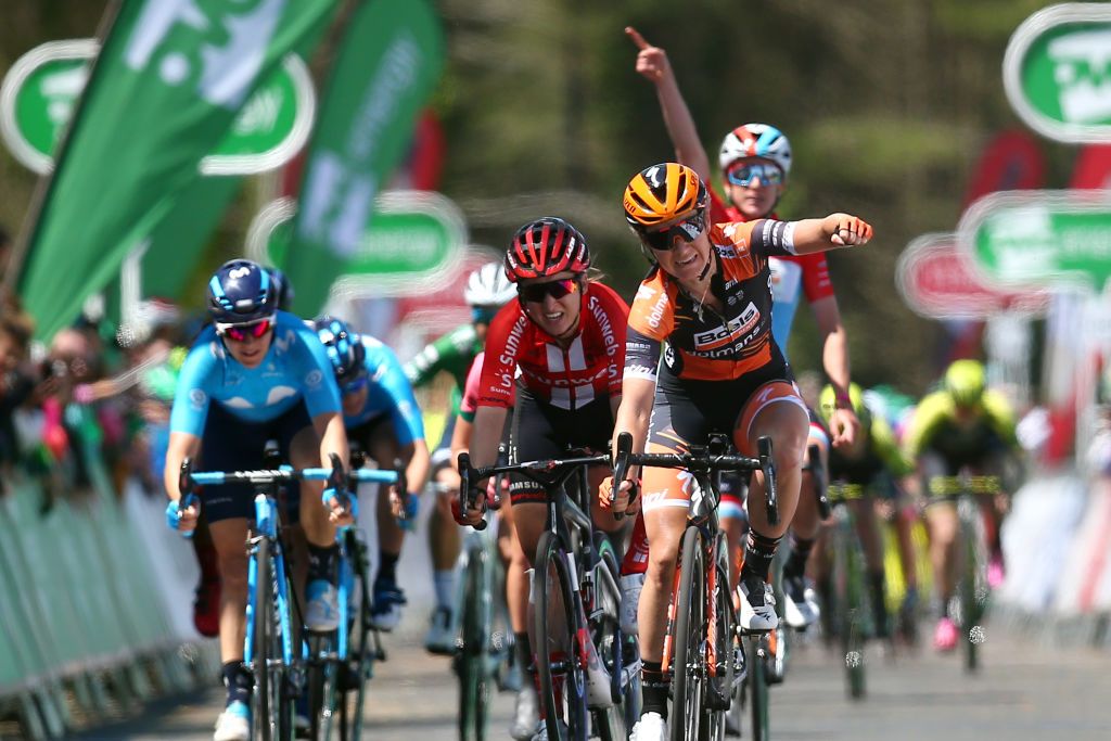 Christine Majerus (obscured, in the red, white and blue jersey) celebrates Boels Dolmans teammate Amy Pieters&rsquo; stage win at the 2019 Women&rsquo;s Tour