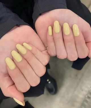 Selena Gomez with butter yellow nails