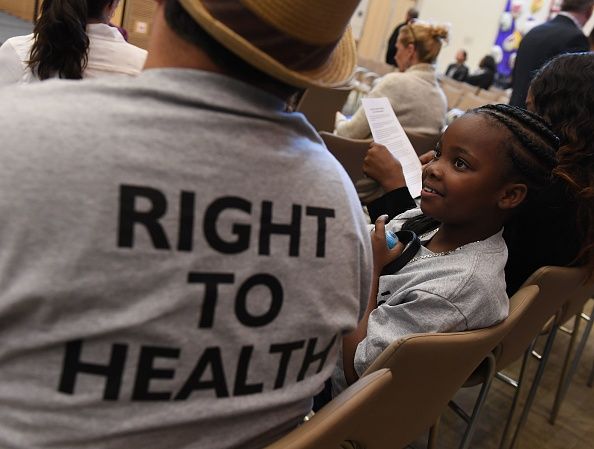 ObamaCare supporters listen to Nancy Pelosi in California. 