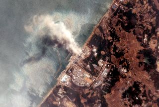 Smoke pours out of Fukushima Daiichi power plant shortly after a devastating earthquake and tsunami struck in 2011.