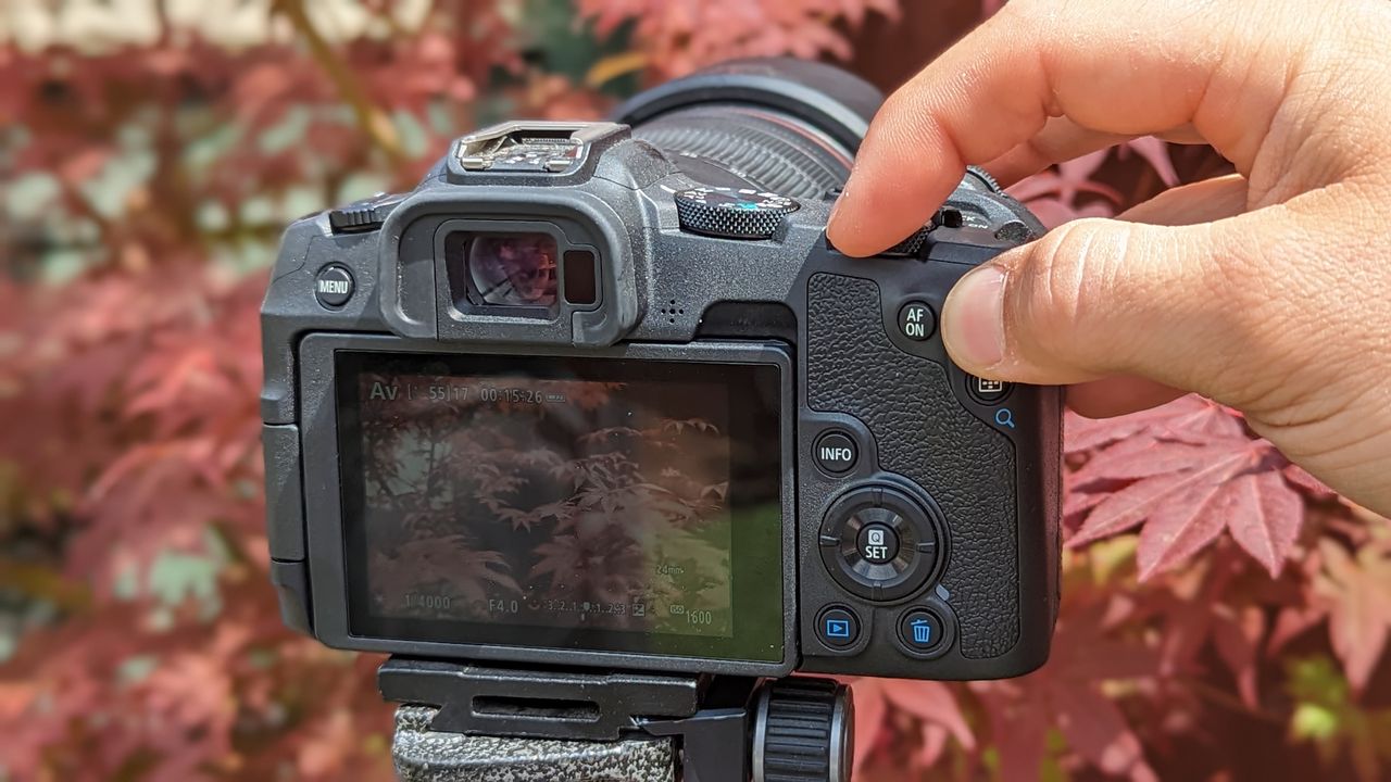 The Canon EOS R8 being used by the reviewer