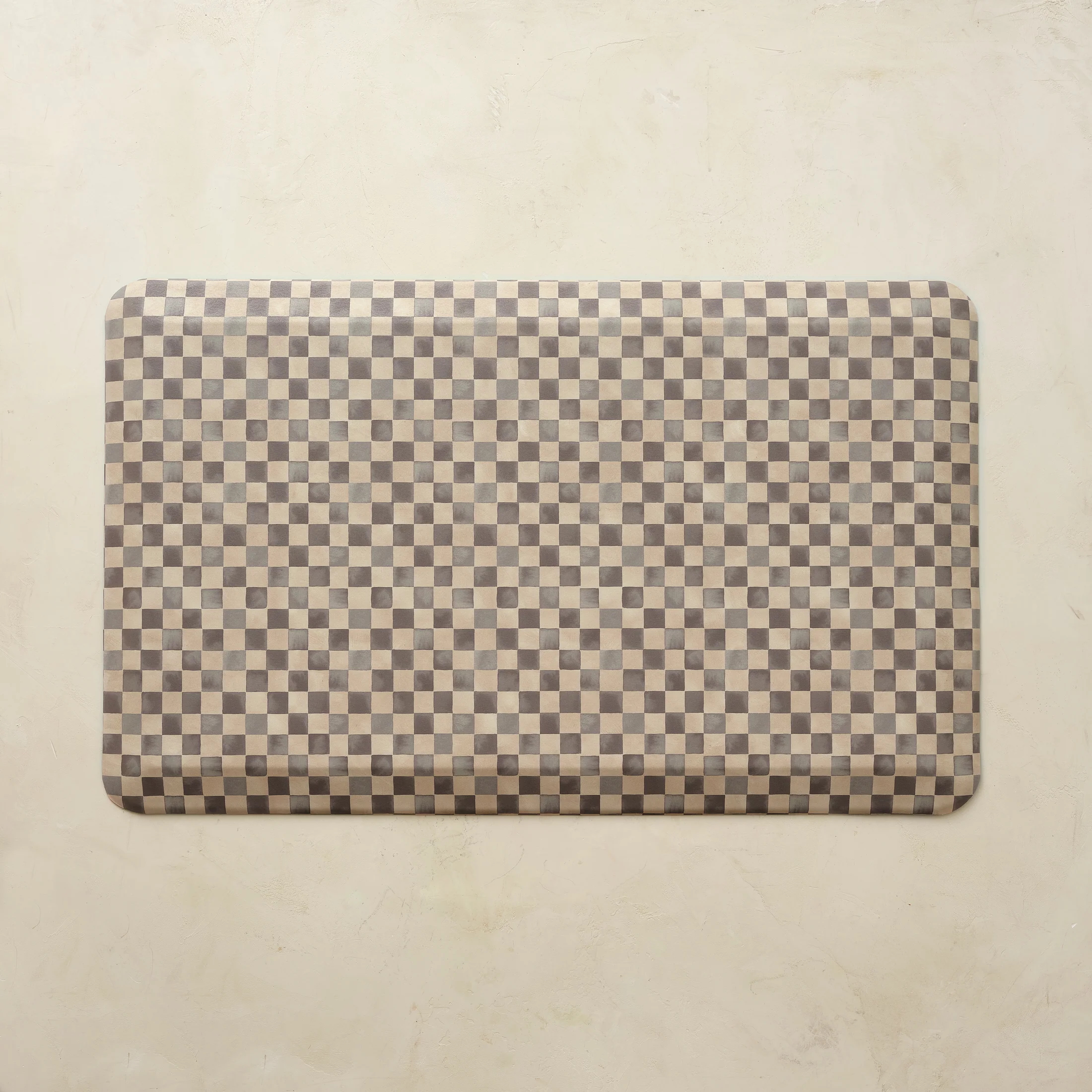 A checkerboard House of Noa  Nama anti-fatigue mat