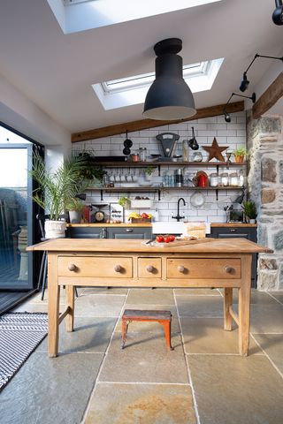 extended kitchen with bi-fold doors and a vintage kitchen island for extra kitchen storage