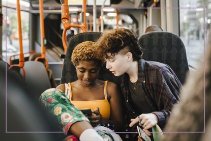 Two teens on abus looking at their phone