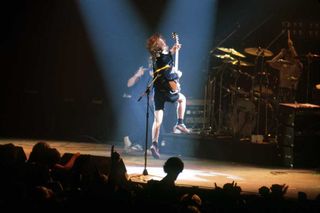 Angus Young onstage at the Palladium in New York
