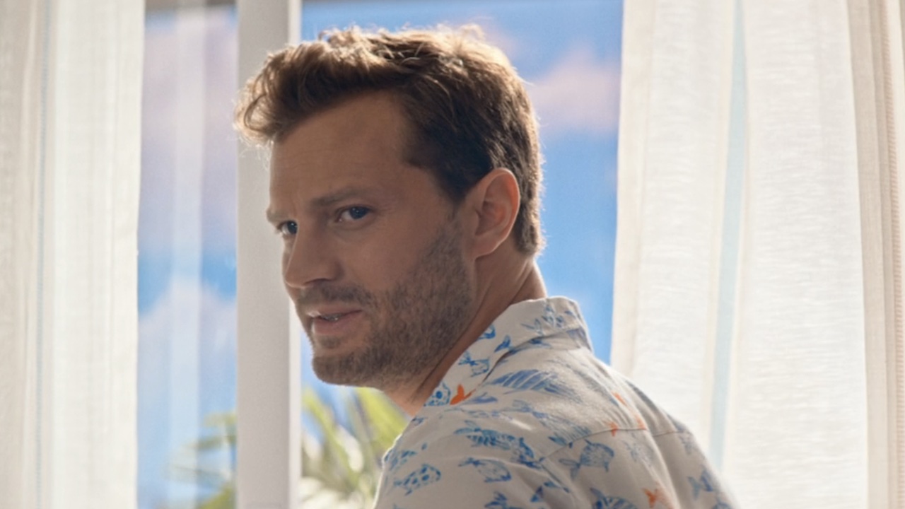 Jamie Dornan's Edgar talking about his relationship next to a window in Barb & Star